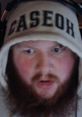 Person with a beard wearing a hoodie labeled "CASEOH," focused and ready for an online streaming session.