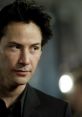 Close-up of Keanu Reeves portraying Neo, showcasing his intense expression and iconic style amidst a blurred backdrop.