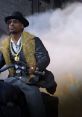 Snoop Dogg in Call of Duty Warzone, dressed in stylish attire with smoke and action in the background.