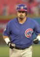 Coomer in a blue Chicago Cubs uniform, focused expression, running on the field during a baseball game.