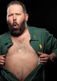 Bert Kreischer showing off his humorous personality with an expressive pose and a playful open shirt.