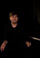 Boran Çolak The hauntingly beautiful melody of "Poem satanique op," played on the piano, fills the room with a sense of