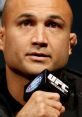 B.J. Penn speaking at a UFC event, showcasing his intense focus and determination in mixed martial arts.