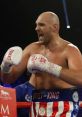 Tyson Fury celebrating in the ring, showcasing his iconic Gypsy King shorts and boxing gloves during a intense match.