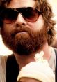 Character from "Hangover" sporting sunglasses and a thick beard, embodying the film's comedic vibe and wild adventures.