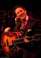 Brando Pizzarelli The mesmerizing of the electric piano fills the air with a sense of nostalgia and sophistication. Brando