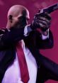 Agent 47, the iconic assassin from Hitman 2, aims his pistol with intense focus against a vibrant pink backdrop.