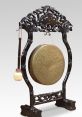 Gong Gongs are more or less flat, circular discs of metal suspended vertically by means of a cord passed through holes