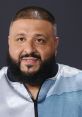 DJ Khaled smiles confidently, showcasing his signature beard and stylish jacket, embodying success in the music industry.