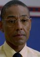 Gus Fring's intense expression in a yellow shirt captures his calm yet menacing persona in the crime genre.