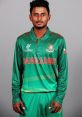 Bangladesh cricketer Aminul in green team jersey, showcasing team spirit and readiness for international competition.