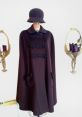 Chic brown cape and hat display, showcasing vintage fashion design by Meri K, perfect for stylish autumn looks.