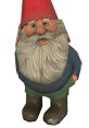 Gnome Chompski with a red hat and gray beard, showcasing a whimsical garden decoration style and playful character.