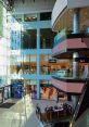 Bright interior of Etele Business, featuring modern storefronts, escalators, and natural light illuminating the atrium.