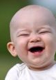 Joyful baby laughing outdoors, capturing pure happiness and innocence, ideal for family and parenting content.