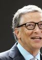 Bill Gates smiling during a speech, wearing glasses and a suit, representing innovation and technology leadership.