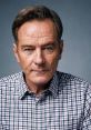 Close-up portrait of Bryan Cranston in a plaid shirt, showcasing his intense expression and captivating presence.