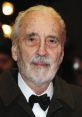 Christopher Lee at a formal event, showcasing his distinguished look, iconic presence, and timeless elegance.