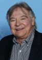 Frank Welker smiles at a public event, showcasing his signature charm and talent as a legendary voice actor.