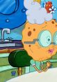 Grandma SquarePants smiles warmly, showcasing her iconic round glasses and curly hair in a cozy kitchen setting.