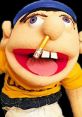 Jeffy puppet with a pencil in his nose, wearing a yellow shirt, showcasing his playful and mischievous character.