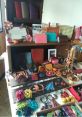 Colorful handcrafted leather goods and accessories from RaffyTaffy displayed creatively in a rustic setting.