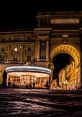 Nighttime scene of Florence, Italy, showcasing historic architecture and a vibrant carousel in the square.