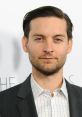 Tobey Maguire in a stylish suit, showcasing a sophisticated look at a red carpet event. Actor and filmmaker.