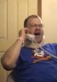 Man with a neck brace shouting into a phone, embodying the comedic chaos of "Tourettes Guy" moments.