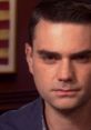 Close-up of Ben Shapiro, notable conservative commentator, discussing political issues with a focused expression.