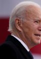 Close-up profile of Joe Biden, 46th U.S. President, displaying a serious expression during a public appearance.