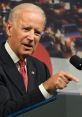 Joe Biden speaks passionately at a podium, expressing frustration with a firm point, set against a busy traffic backdrop.