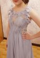 Elegant light lavender dress with floral embellishments and sequins, perfect for formal events and special occasions.