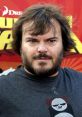 Jack Black poses for the camera in a casual black shirt featuring a panda design, showcasing his signature style.