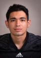 Brandon Montes in a black athletic jersey, showcasing determination and focus in a professional headshot.