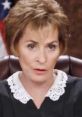 Judge Judy displays an intense expression while presiding in court, showcasing her authoritative demeanor and determination.