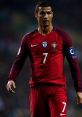 Cristiano Ronaldo in Portugal's national team jersey, showcasing leadership on the field during a match.