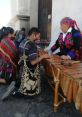 Traditional Maya musicians demonstrating craftsmanship on a marimba, showcasing cultural heritage and vibrant attire.