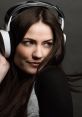 Stylish gamer girl with long hair and headphones, exuding confidence and passion for gaming in a striking close-up portrait.