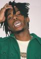 Cash Carti showcasing his signature style with grills and a stylish outfit, exuding confidence and urban flair.