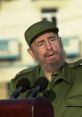 Fidel Castro addresses the audience, wearing a military uniform and cap, during a speech in Cuba. Historical leader moment.