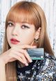 Lalisa Manobal showcasing beauty with a stylish card, featuring striking makeup and glamorous fashion.