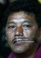 Close-up of Binil Gurung, featuring distinct facial features and an intense expression, emphasizing his presence and character.