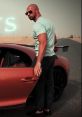 Andrew Tate showcasing luxury lifestyle with high-performance sports car in a desert setting, embodying the "Top G" effect.