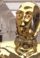 C3PO in shiny gold plating, set against a sleek, futuristic background, showcasing its iconic design and detailing.