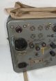 World War II radio equipment featuring tuning dials, switches, and connectors for communication purposes.