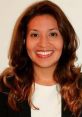 Professional headshot of Alejandra Villada Morales, showcasing her confident smile and approachable demeanor in business attire.