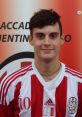 Giovanni Andreucci, wearing a red and white striped jersey, representing Cluentina Calcio.