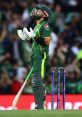 Md Rizwan expressing emotion during a cricket match, wearing a green Pakistan jersey and holding his bat.