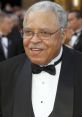 James Earl Jones smiles in a tuxedo at a formal event, showcasing his iconic presence and legendary career in film.